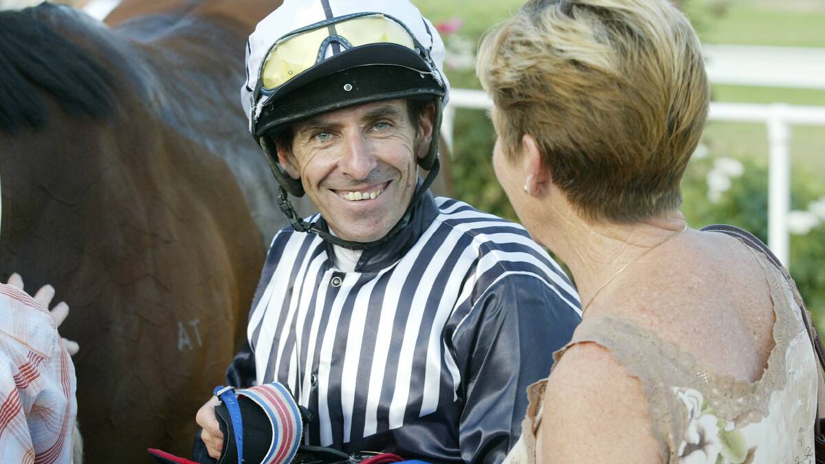 WINNERS: Jockey Brian Johns with Anne Taylor after riding Mooncoin Magic to victory at Albury in the Jindera Cup in 2006.