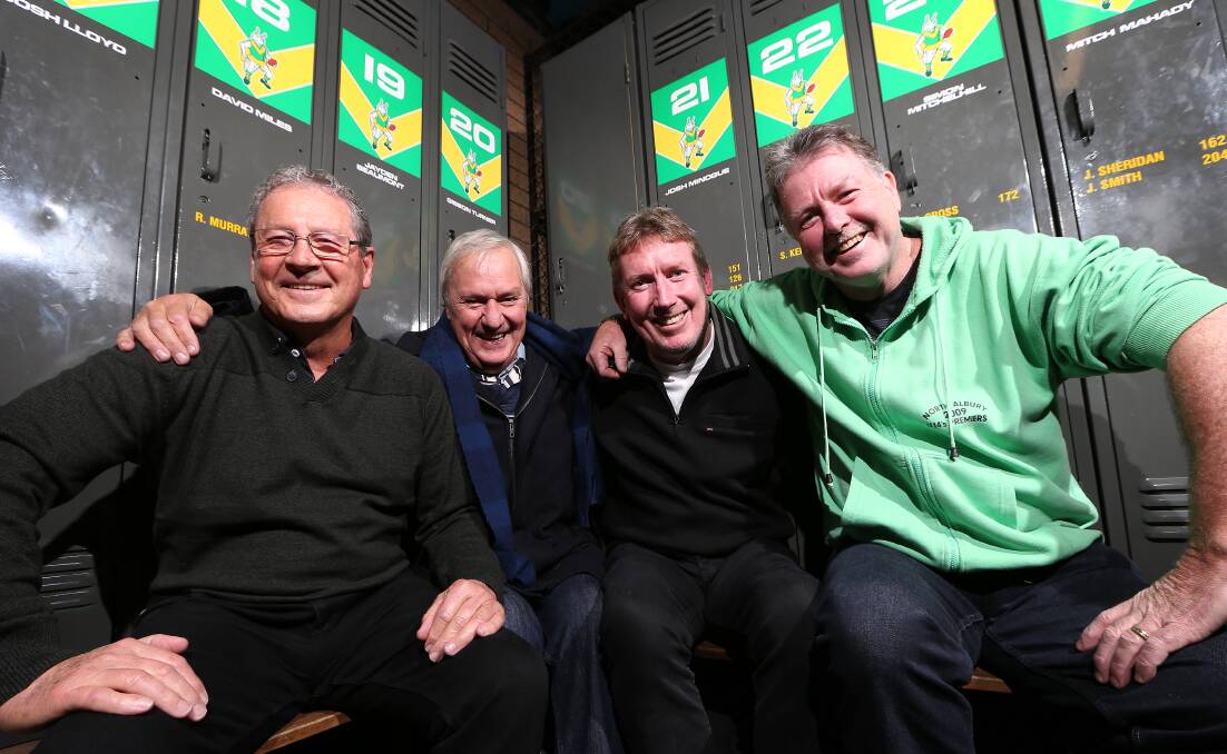 REUNION: Cross, Peter Westland, Terry Farrell and Tim Taylor celebrate North Albury's 1984 flag success in 2014.