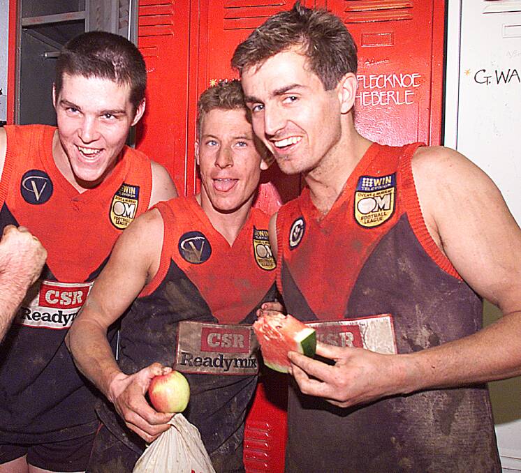 WINNERS: Conway (far right) celebrates a finals victory in 2001 with Dale Andrews and Fraser Stevenson.
