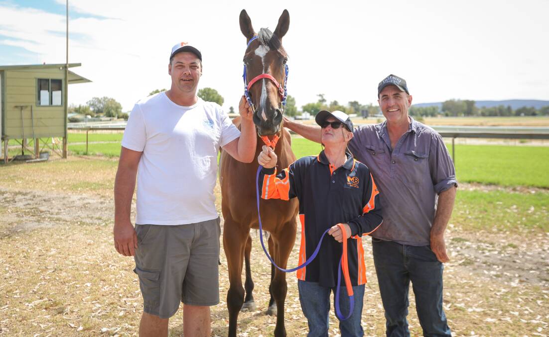 Wodonga trainer Heath Maclean, strapper Lenny Andrews and part-owner Connor Barton with Testing The Cugat on Wednesday. Picture by James Wiltshire