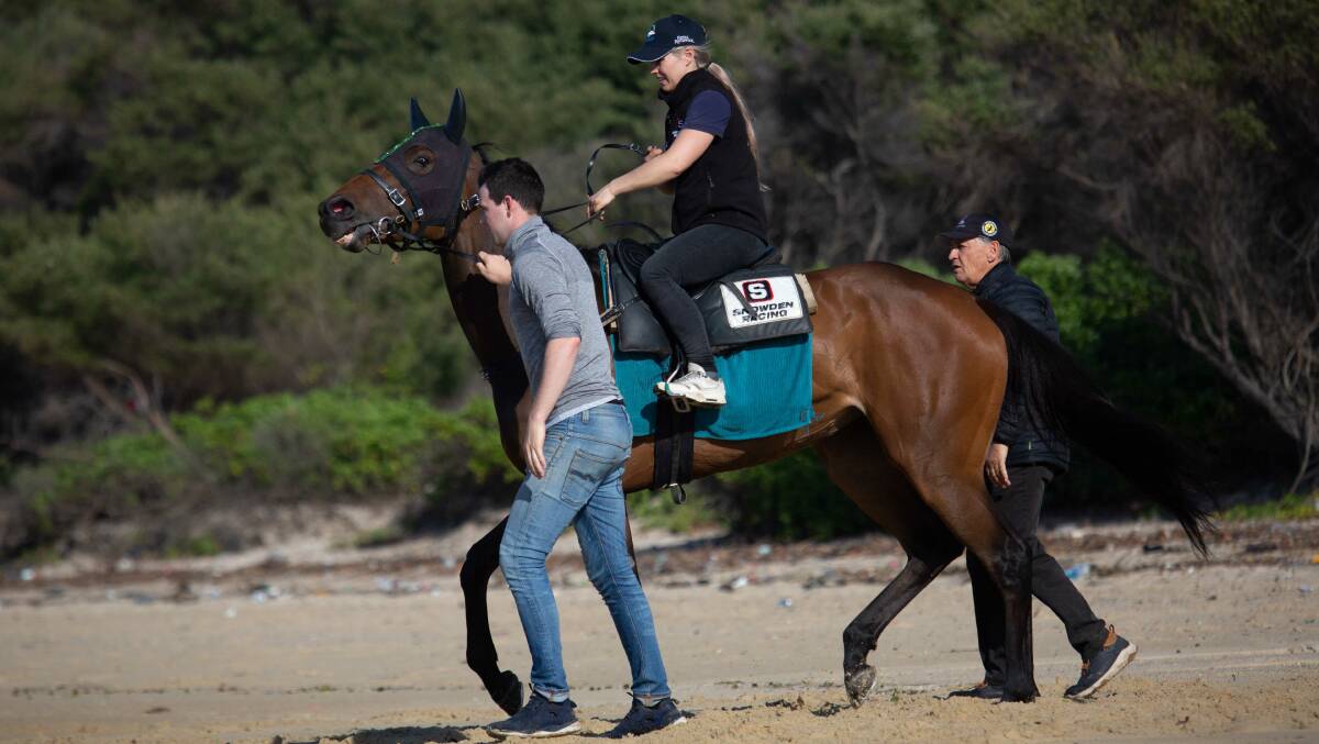WITH THE BOSS: Frazer Dale with Peter Snowden during some morning trackwork on the beach.