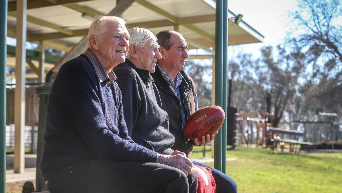 MIGHTY SWANS: Ken Lindner, Bill Barton and Tom Doolan are eagerly anticipating the Swans 1969 flag reunion next weekend. Picture: JAMES WILTSHIRE