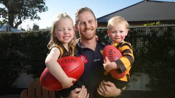 Kiewa-Sandy Creek co-captain Jack Andrew with his kids Norah, 3, and Myles, 2. Picture by James Wiltshire