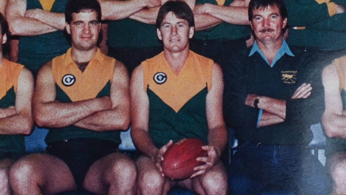 Hollands (centre) coached Tallangatta to the flag in 1989.