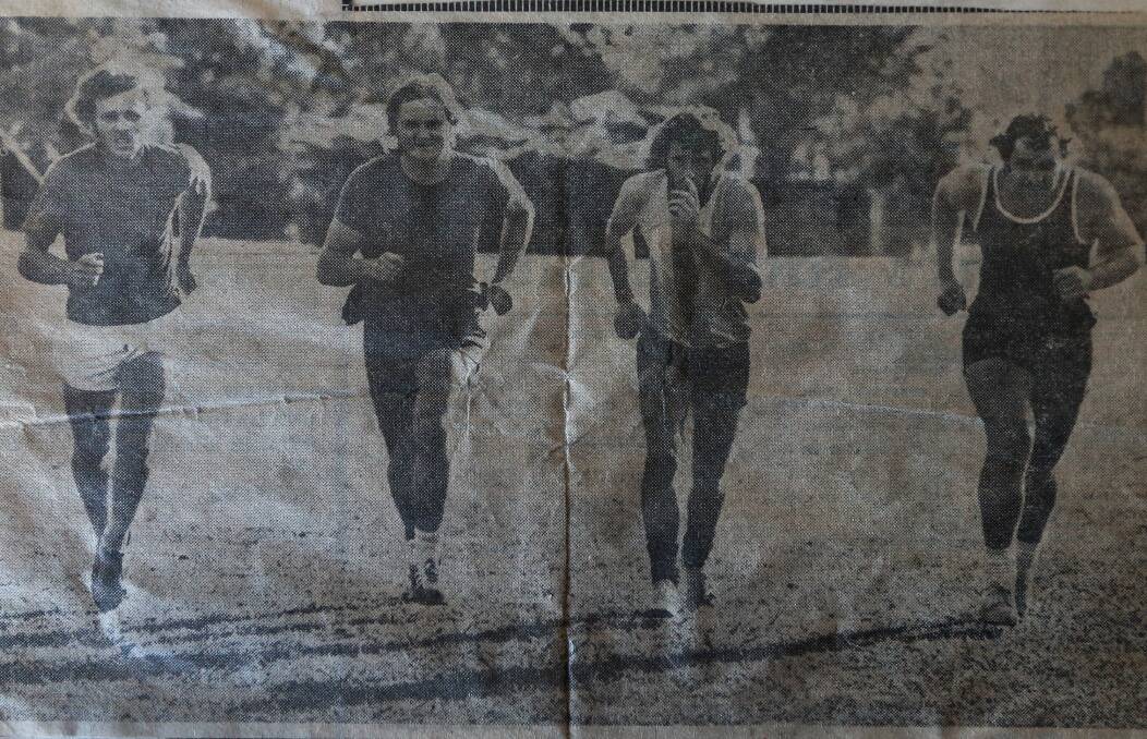 Terry Cross (left) and Gibbons (right) put in the hard yards at a Tigers' training session.