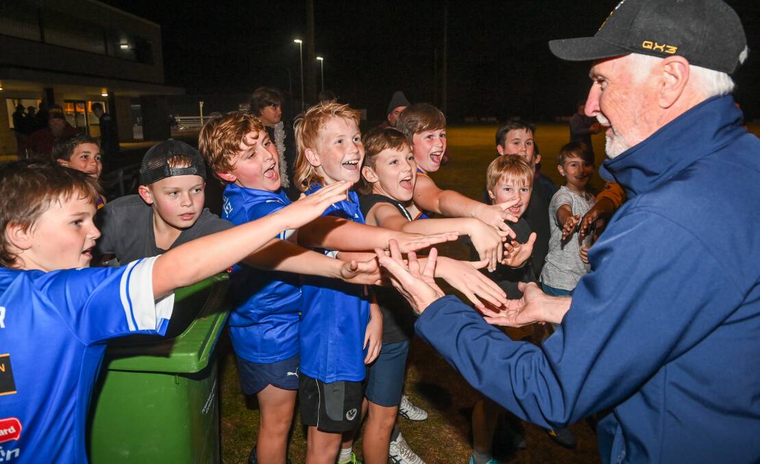 HIGH FIVE: Mick Malthouse was a major hit with the Lions'
cubs.