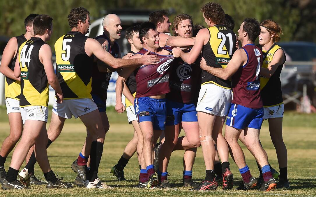 HIGH STAKES: Osborne and Culcairn players exchange pleasantries at Culcairn on Saturday. Picture: MARK JESSER