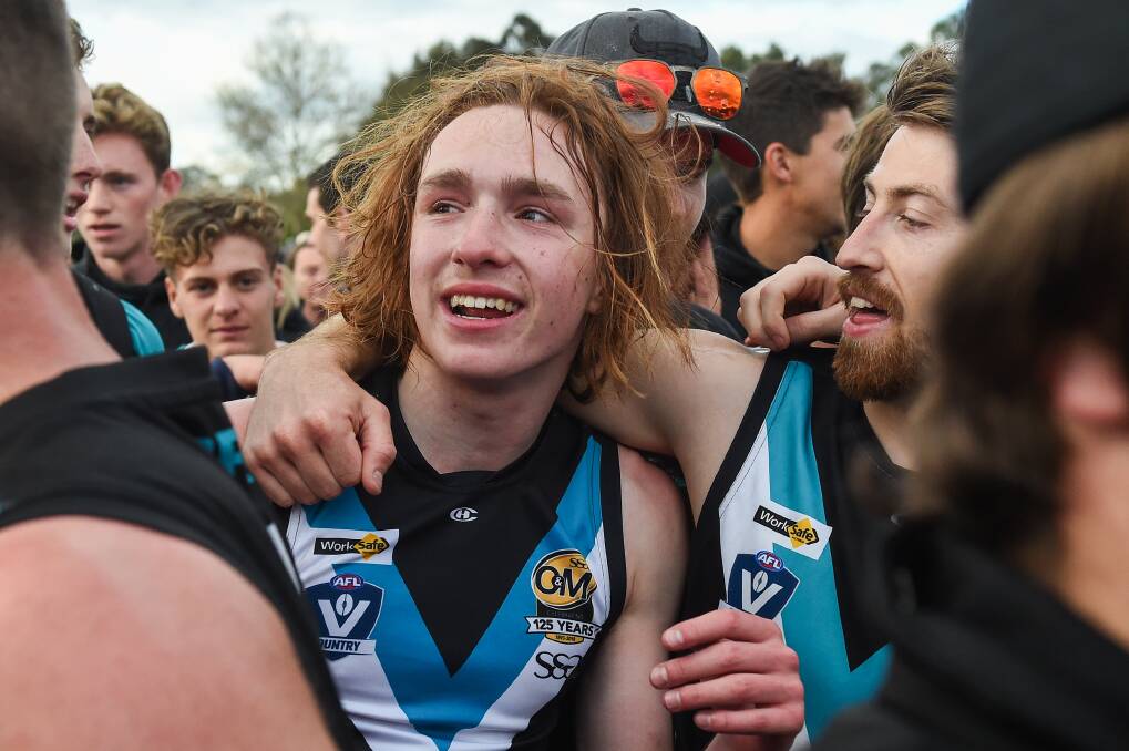 Macca Hallows celebrates the Panthers' 2019 flag triumph.