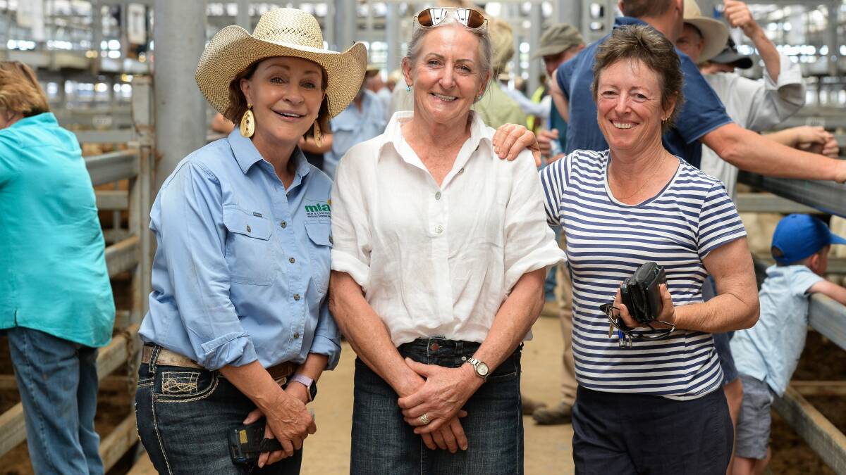 CATCH-UP:  Leann Dax, Sharon Nankervis and Kate Thomas from Corryong and Tallangatta catch up for a quick chat at the sales.
