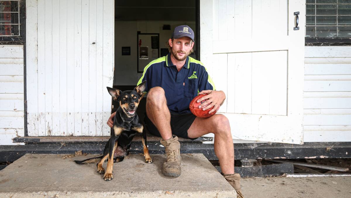 CRISIS: Border-Walwa footballer Ash Greenhill,
with Russ the three-legged dog. Picture: JAMES WILTSHIRE