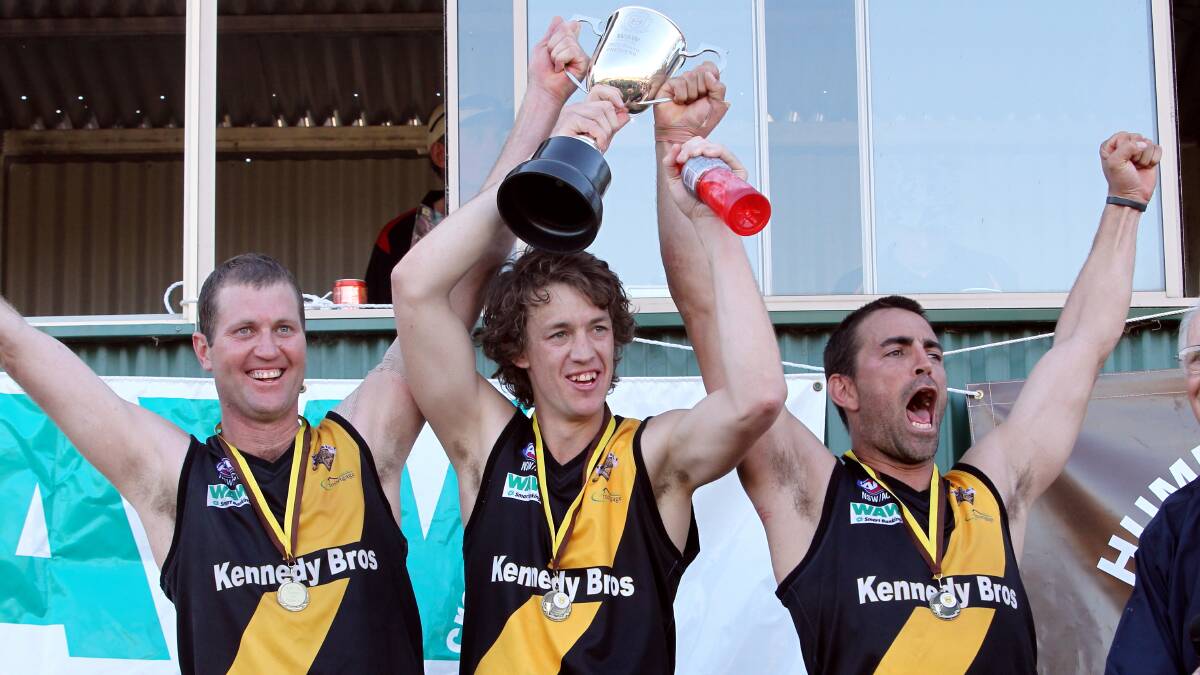 PREMIERS: Hayden "Fossil" Gleeson, Jamie Parr and Daniel McAlister celebrate the Tigers' 2012 flag triumph.