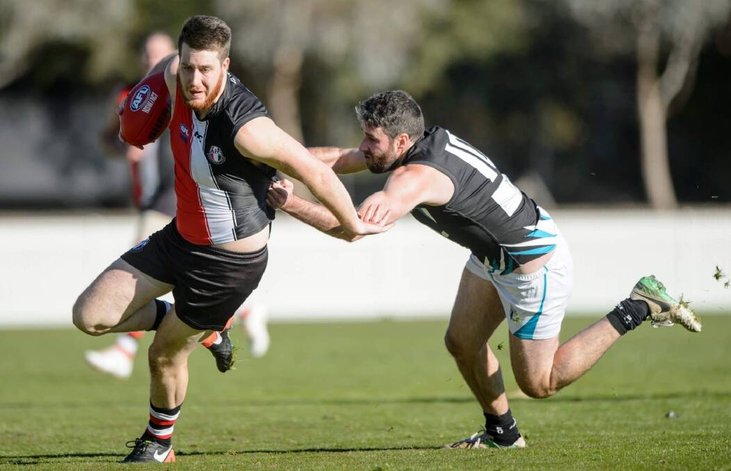 Hayden Armstrong (left) in action for Ainslie. Picture: CANBERRA TIMES