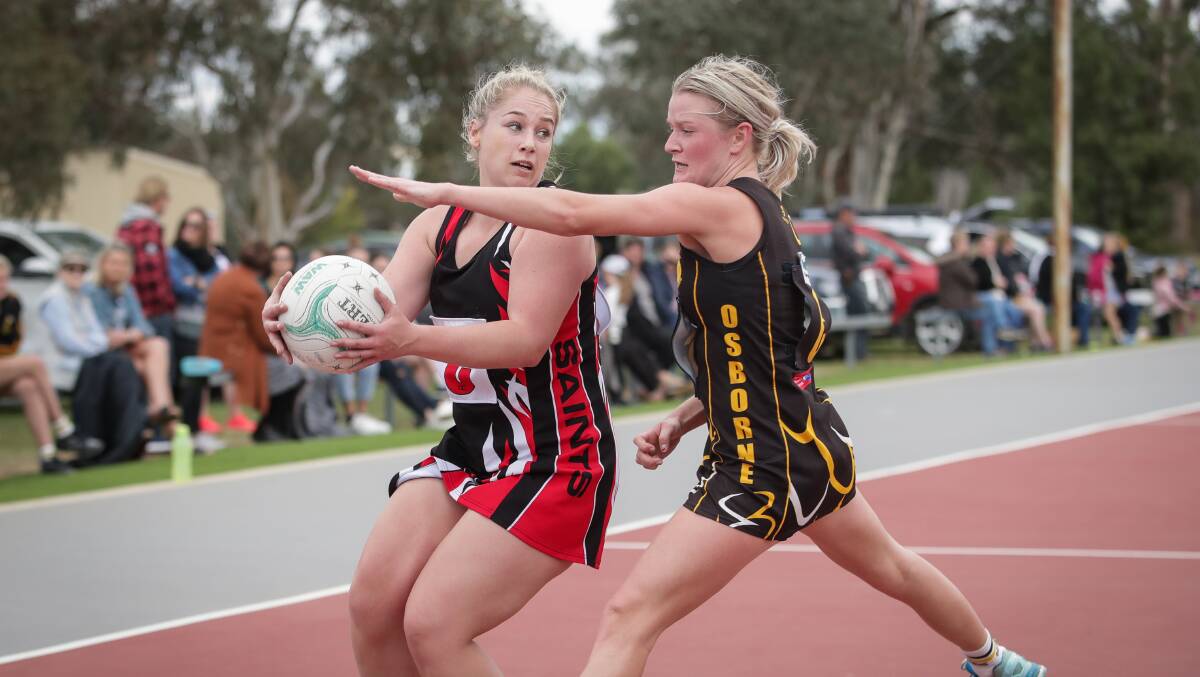 PRESSURE TIME: Brock-Burrum;s Kaitlin Maher and Osborne's Courtney Menzies in action on Saturday. Picture: JAMES WILTSHIRE