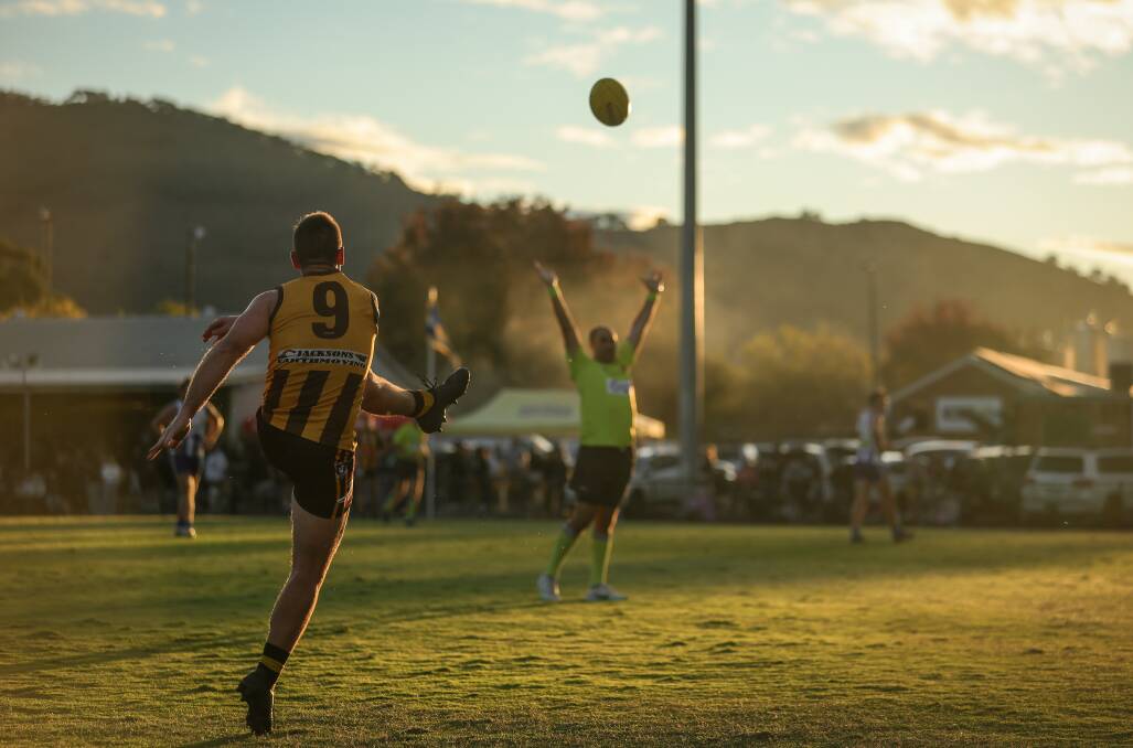 Star Hawks midfielder Josh Hicks sends his side forward as the sun sets in the background at the picturesque Coulston Park. Picture by James Wiltshire