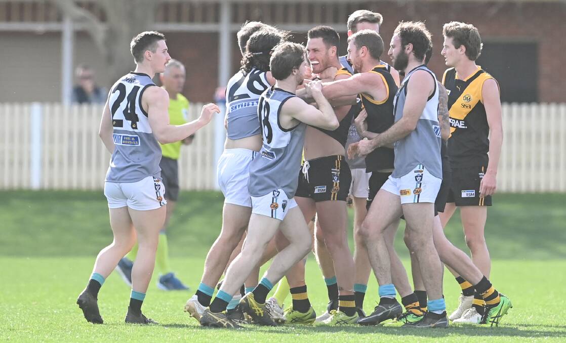 PUSH AND SHOVE: Albury and Lavington players engage in a bit a push and shove on Saturday. Picture: MARK JESSER