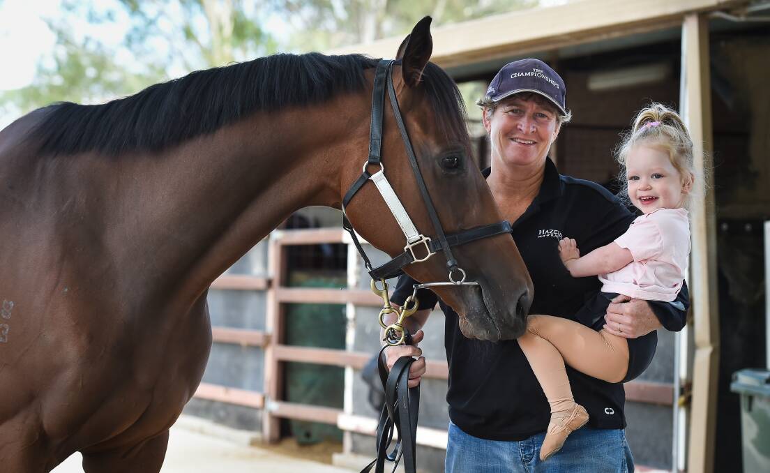 PRIMED: Trainer Donna Scott with her granddaughter, Penelope, and Bennelong Dancer who is set to contest a third Country Championship final at Randwick on Saturday.