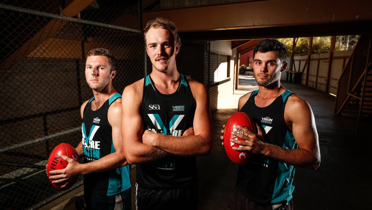 Aidan Johnson (centre) is still weighing up his playing future.