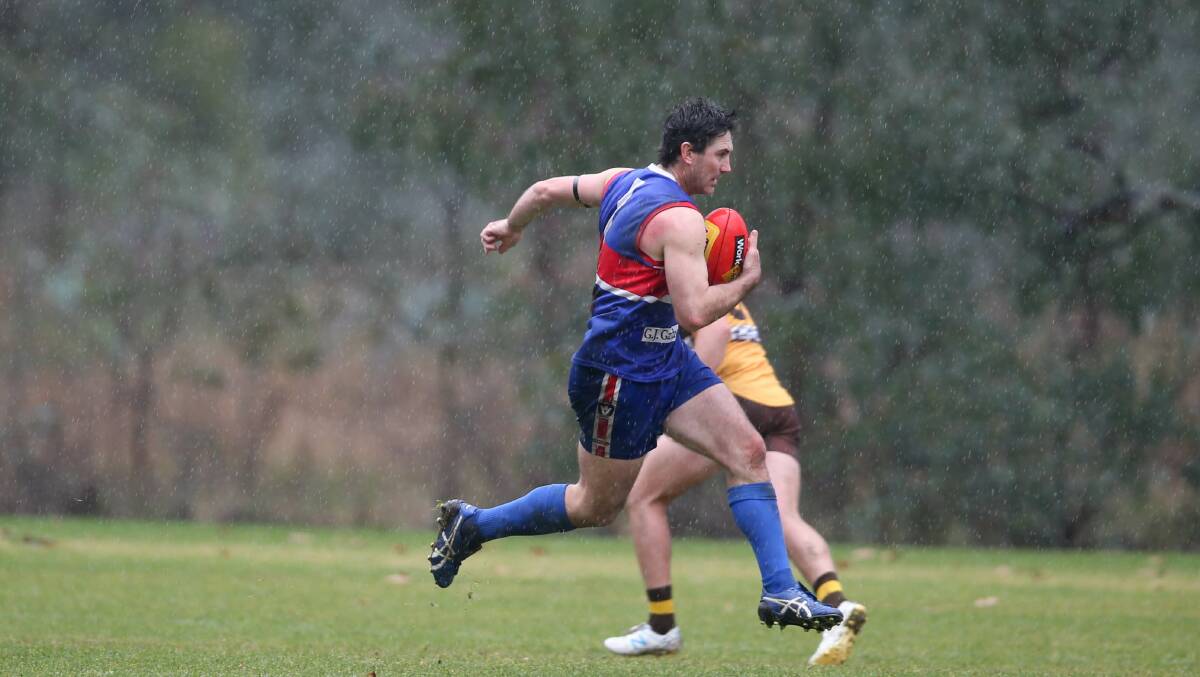 RAGING BULL: Thurgoona's Aydan Brown charges forward in the slippery conditions on Saturday. Picture: TARA TREWHELLA
