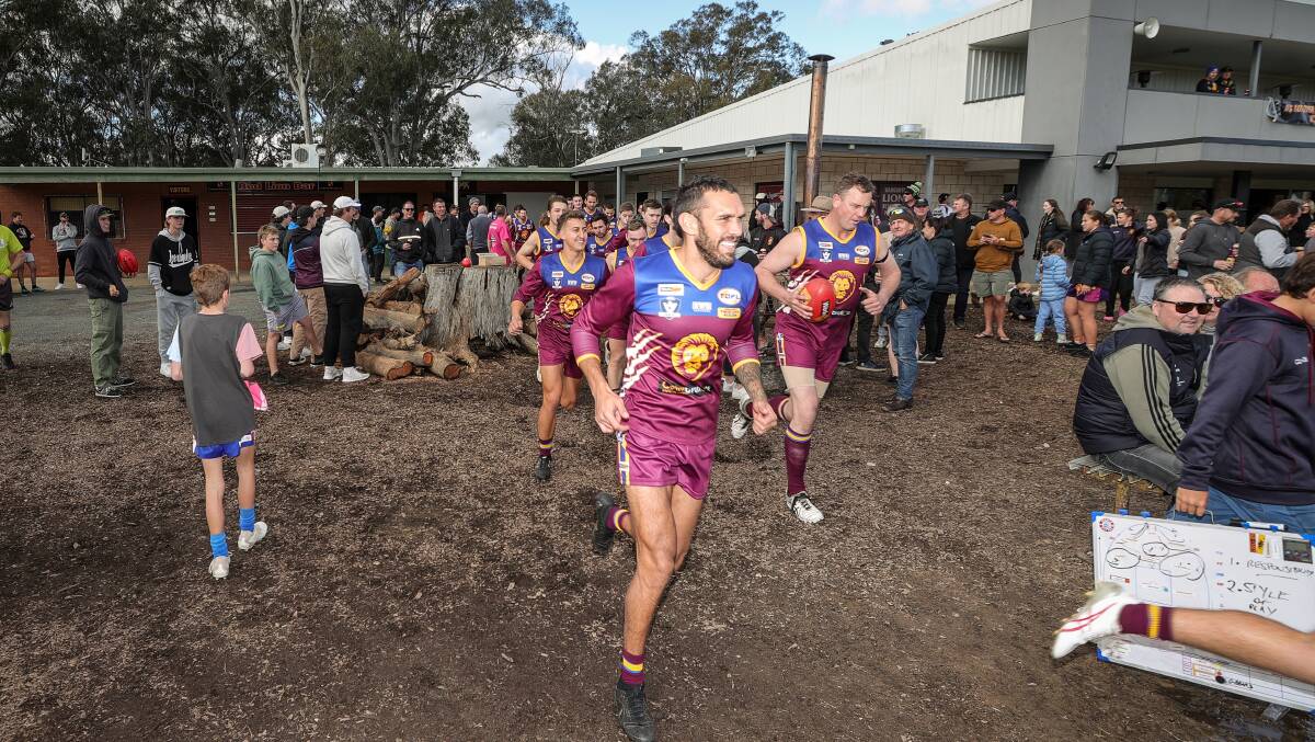 Harley Bennell and Chris Willis lead the Lions out against Thurgoona. Picture by James Wiltshire