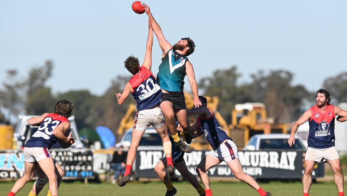 BIG MEN FLY: In-form CDHBU ruckman Callum Butler contests a centre bounce against Lockhart's Jack Muldoon recently which the Power won after a second-half comeback. Picture: MARK JESSER