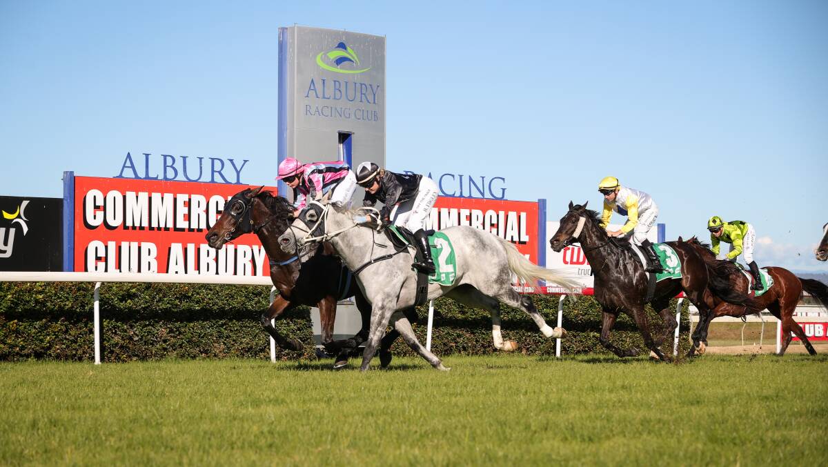 CLOSE CALL: Former Albury apprentice Teighan Worsnop won the $24,000 Benchmark 58 Hcp, (1182m) aboard Dancing With Kitty (inside) for Berrigan trainer Paul McVicar. Picture: JAMES WILTSHIRE