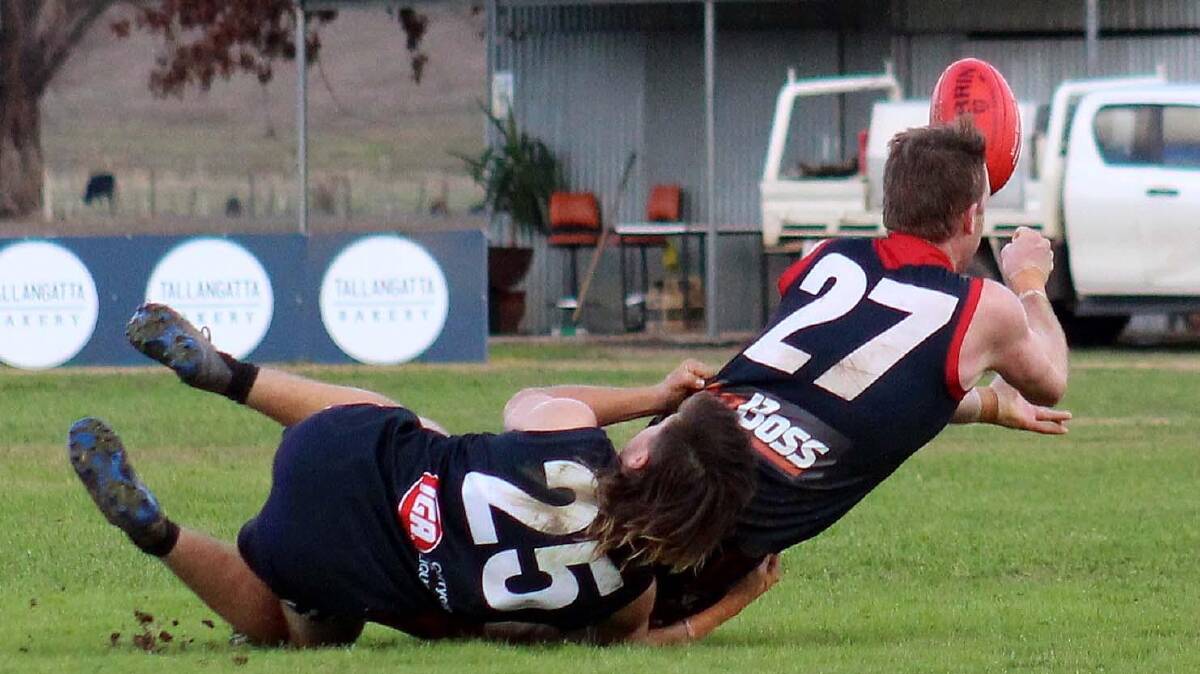 WRAPPED-UP: Cudgewa's Darcy McKimmie nabs his Corryong opponent during their clash at Cudgewa on Saturday. Picture: DEB HARRAP 