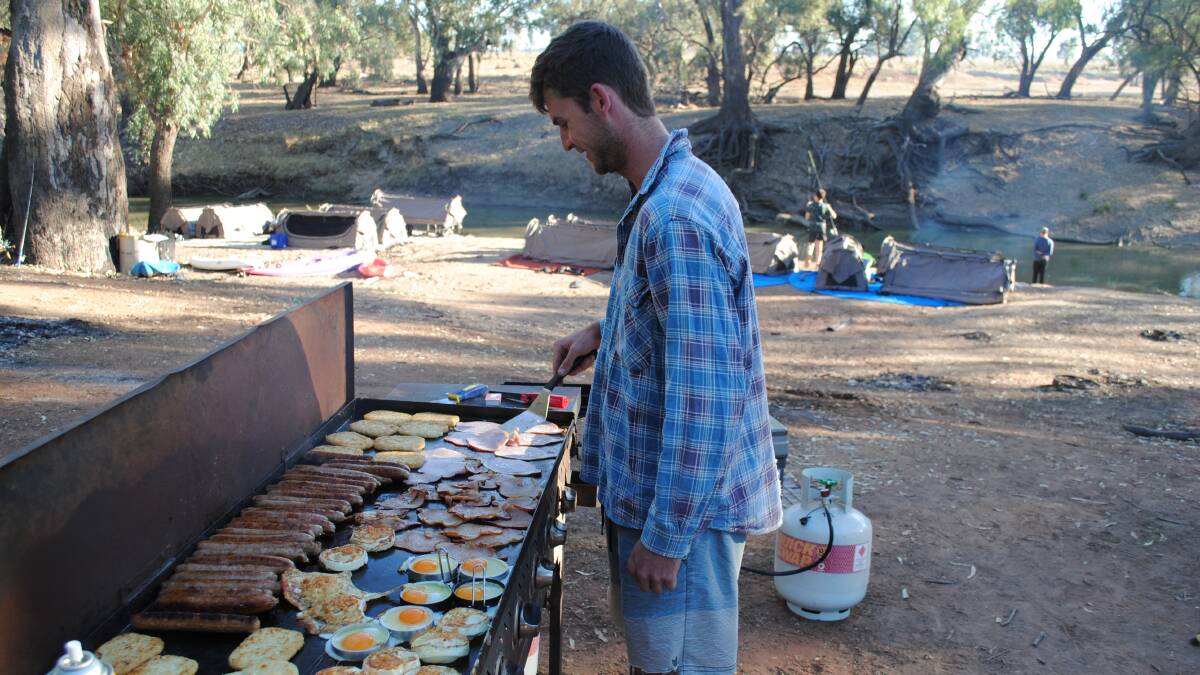 WHAT'S COOKING: Cooking is another skill the boys learn at the camps. Nothing beats a hearty breakfast of bacon, sausages, eggs and hasbrowns to start the day.