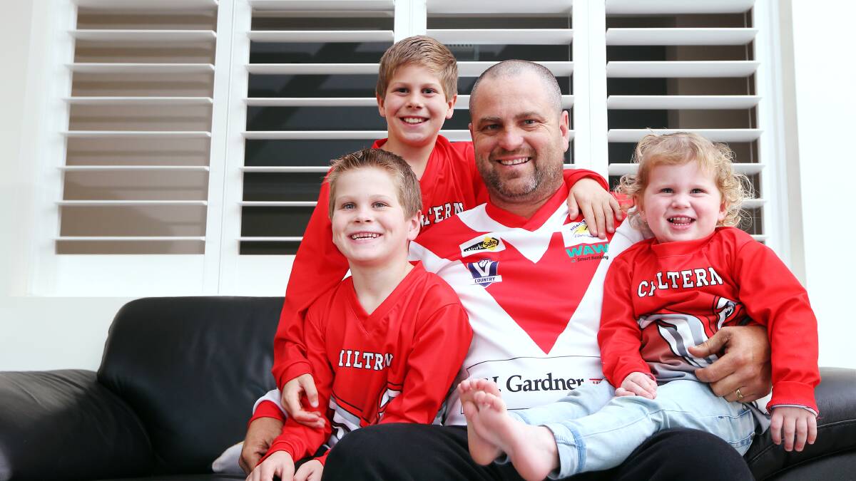 FAMILY MAN: Brookes with his family in 2014 ahead of his 300th match. His three children play for the Swan juniors this season.