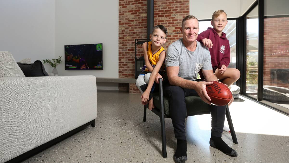 FAMILY MAN: Jarrod Twitt relaxes at home with his two boys, Jordy, 8, and Hardy, 10. Picture: JAMES WILTSHIRE