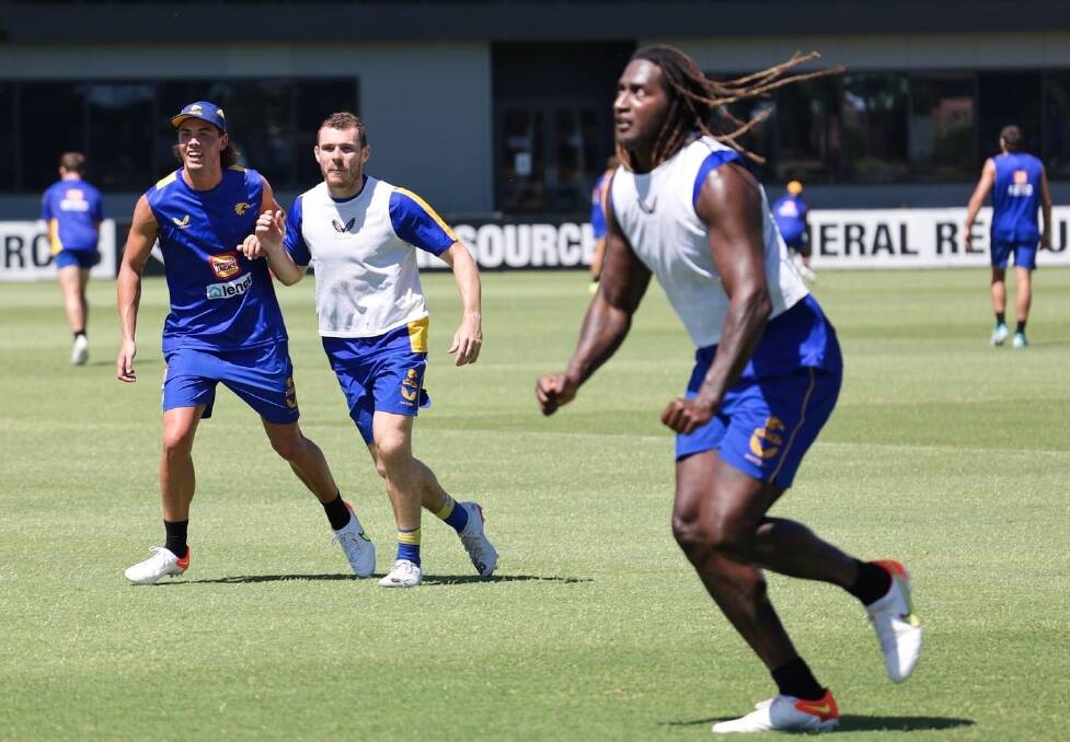 LIVING THE DREAM: Chesser at West Coast Eagles training alongside star players Luke Schuey and Nic Naitanui.