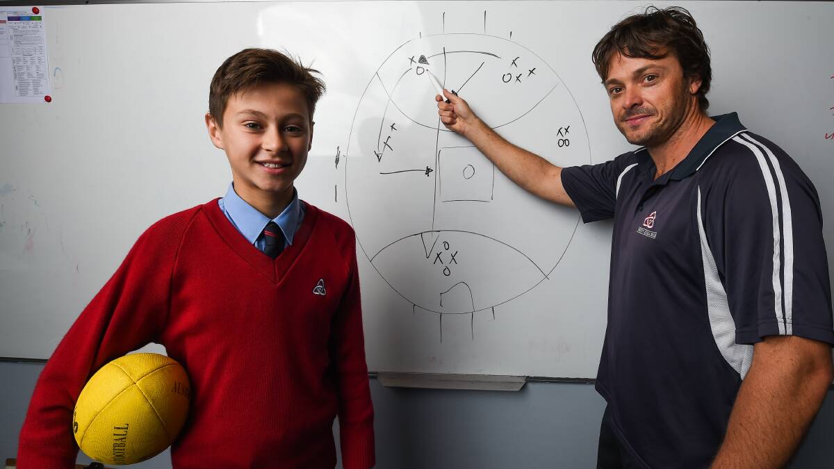 Saints coach Kade Stevens with Trinity Anglican College student, Harrison Wilson. Both Stevens who are in Perth for the state football carnival. Picture: MARK JESSER