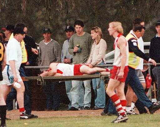 Cameron Male is carted off on a stretcher during the 1998 grand final against Osborne.