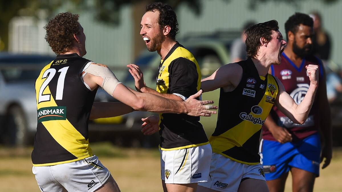 PARTY TIME: Osborne's Kodie O'Malley, Martin Bahr and Connor Galvin celebrate a goal in their big win over Culcairn.