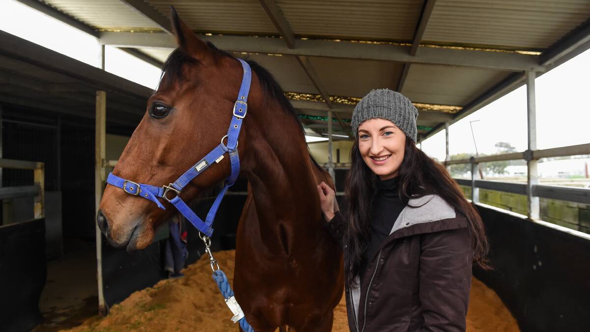 RARING TO GO: Laura McCullum with Makaretu Boy. McCullum will initially train 12 horses from her stable. Picture: MARK JESSER