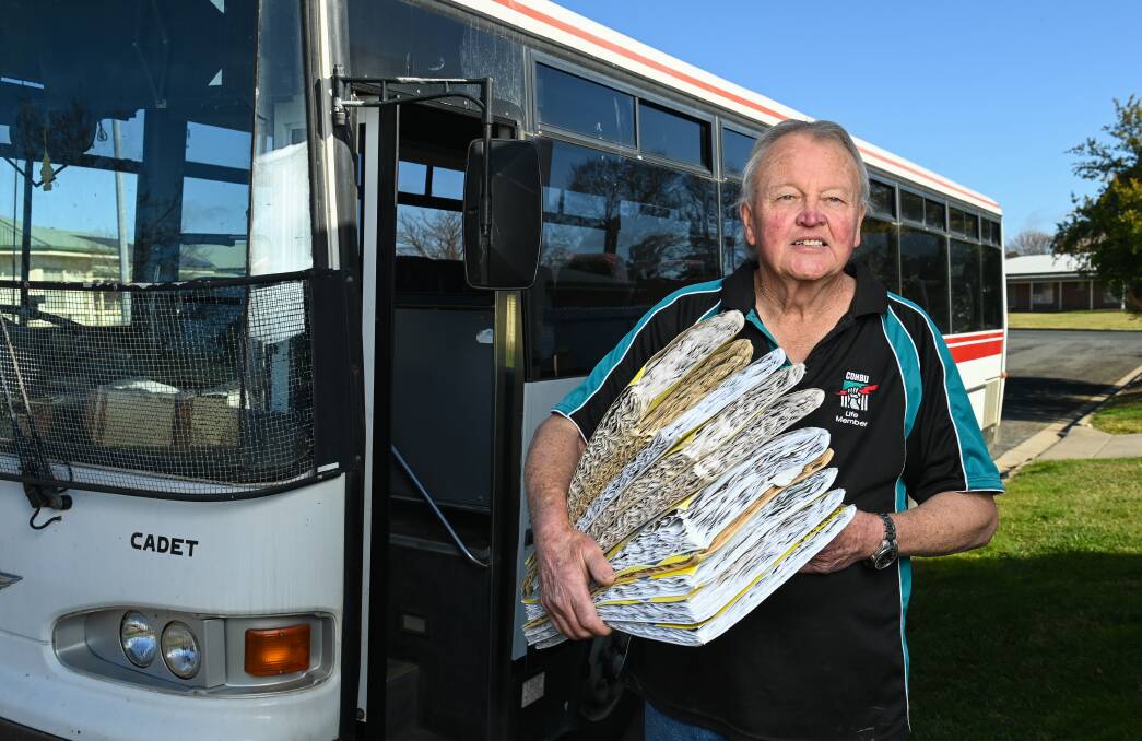 Chris 'Darkie' Collins with just some of large collection of scrapbooks. Picture: MARK JESSER