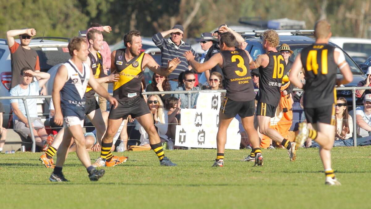BIG STAGE: Peter Cook in action during the 2013 grand final against Mitta United. Cook expects the Tigers to figure prominently in September again this season.