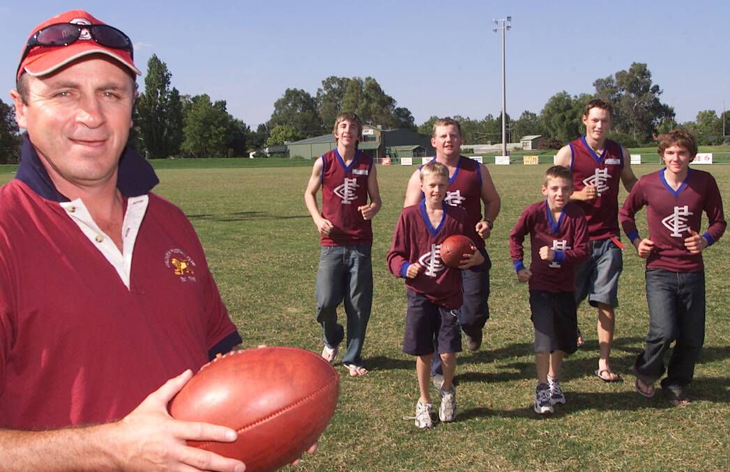 LION CUBS: Gordon 'Froggy' Finlayson at footy training with his son, Jeremy (third from right), in 2005. Jeremy made his debut for GWS in 2017 and has played 37 matches and booted 48 goals.