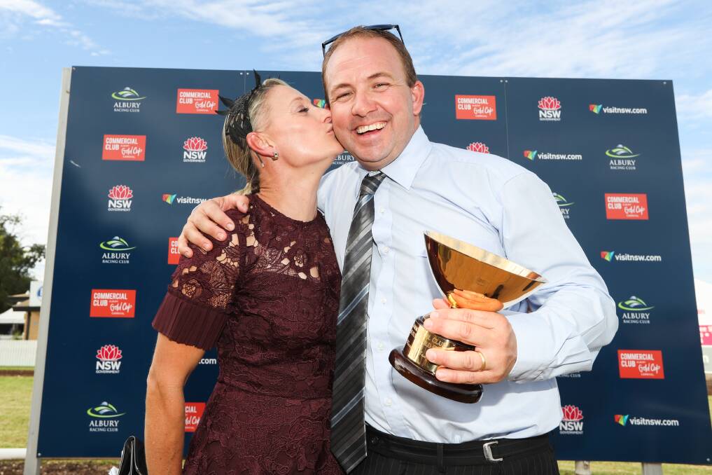 ALL SMILES: Wodonga trainer Craig Widdison and wife Kelly with the spoils of victory after the 2018 Albury Gold Cup.