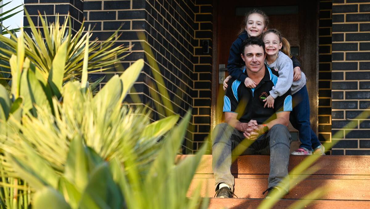 FAMILY MAN: Brett Doswell with his two daughters, Milla, 7 and Halle, 4. Picture: MARK JESSER 