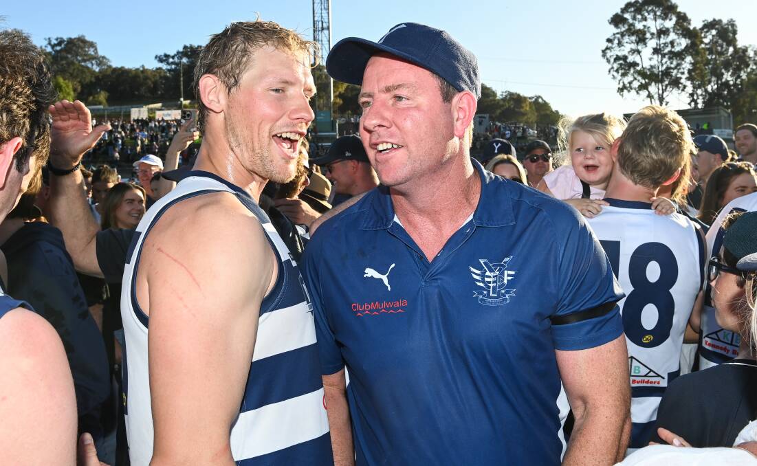 Stevie J and star Pigeon forward Leigh Williams share a moment after their grand final over Albury at the Lavington Sports Ground last year. Picture by Mark Jesser