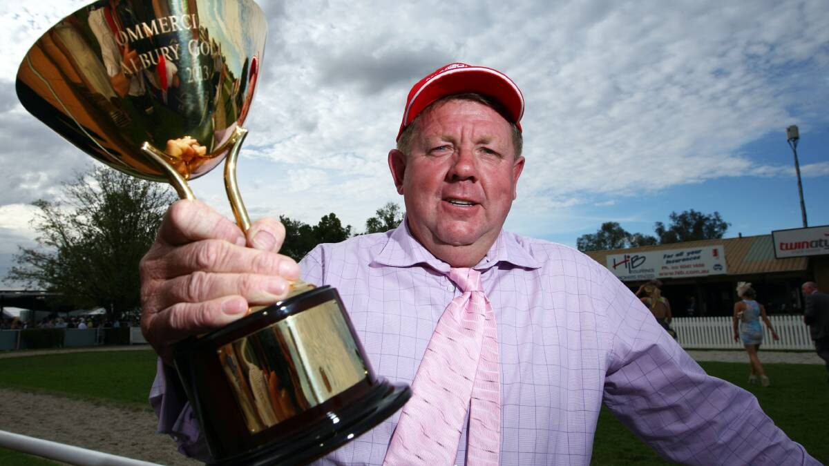 SPOILS OF VICTORY: Trainer Brett Cavanough with the 2013 Albury Gold Cup won by Niblick after the most controversial finish in cup history.