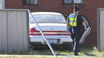 Wodonga police are continuing their investigations into a crash in West Wodonga that saw a white Holden Statesman go through a fence and into a house on Silva Drive on Thursday, March 28. Picture by Mark Jesser