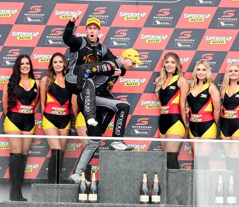 SWEET VICTORY: David Reynolds 
celebrates with co-driver Luke Youlden 
atop the podium at the Bathurst 1000.