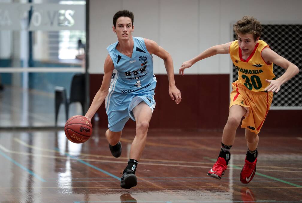 Lachlan Mihai in action for the NSW Kookaburras' under 16s against the Tasmanian Tigers during Wednesday's matches at the Australian Country Junior Basketball Cup. Picture: JAMES WILTSHIRE