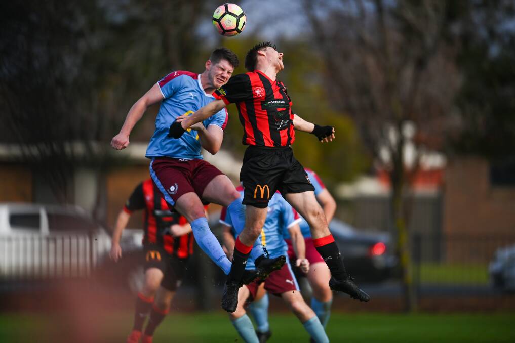 ALL ON THE LINE: Twin City's Mitchell Reid and Wangaratta's Ryan Luty compete for a header in an entertaining clash at Kelly Park on Sunday. The Wanderers led on three occasions, but had to settle for a draw. Picture: MARK JESSER