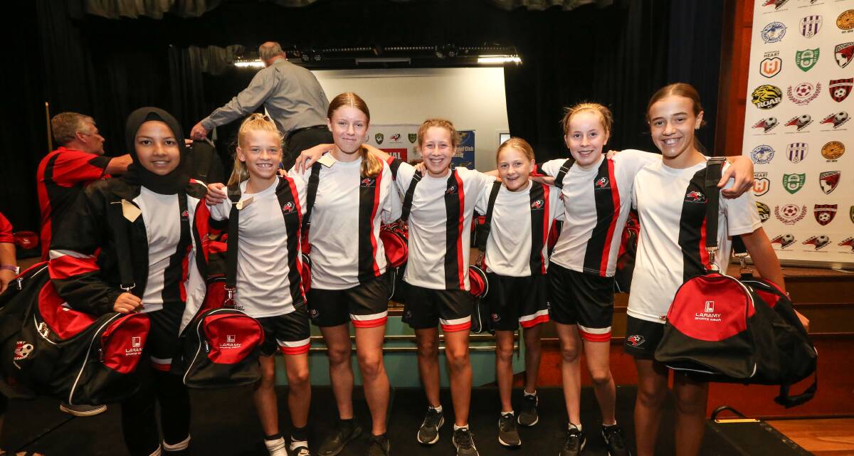 ALL SMILES: Members of AWFA's under-14 girls representative team receive their kit bags at Saturday's presentation. Pictures: JAMES WILTSHIRE
