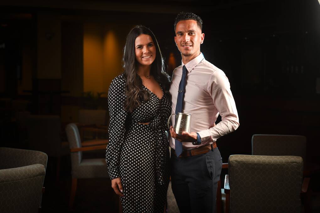 CLASS ACT: Adam Burchell, with fiance Kirsty Lewis, won the Star Player and top goal-scorer despite missing four matches. Pictures: MARK JESSER