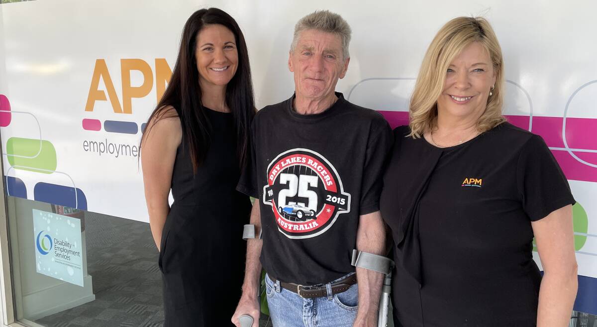 APM business manager Emma Harris, client Wayne Fraser and employment consultant Wendy Beer at the organisation's International Day of People with a Disability event on Friday.