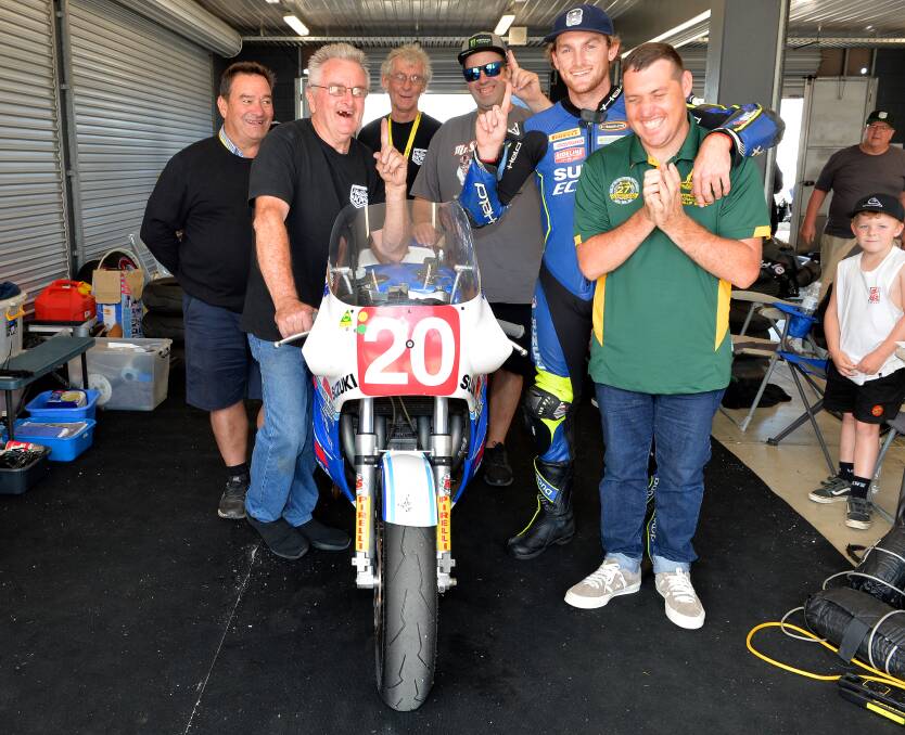 NUMBER ONE: Albury's Alex Phillis celebrates his International Challenge victory at Phillip Island with his support team. Pictures: RUSSELL COLVIN