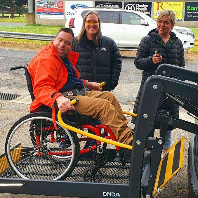 ON THE MOVE: Wangaratta's Wil Moore, with carers Emma Haag and Monqiue Gibson, testing out his new Toyota van which has a loading ramp for his wheelchair.